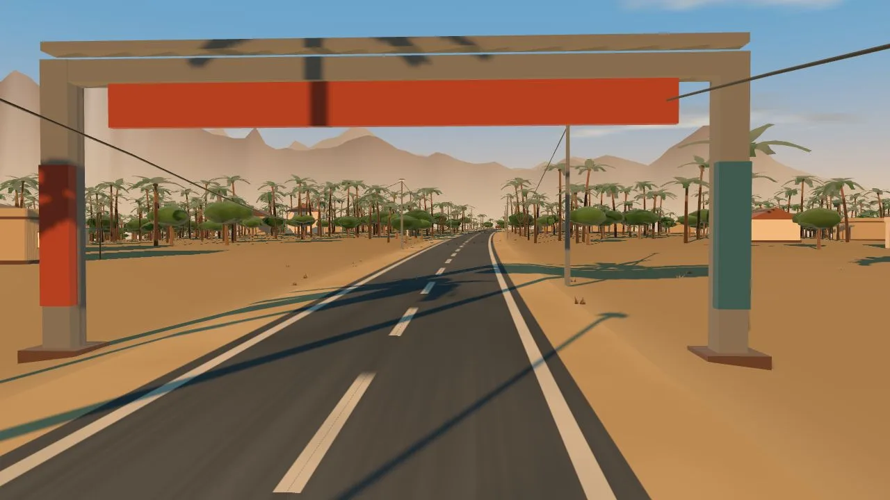 Passing beneath a finish gantry with a red banner spanning the road